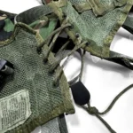 Rear corset-style paracord adjustment system for a customizable fit on the Enhanced Tactical Load Bearing Vest.